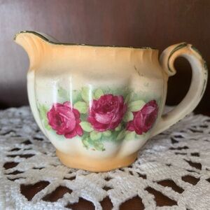 Elegant Cream and Pink Ceramic Pitcher
